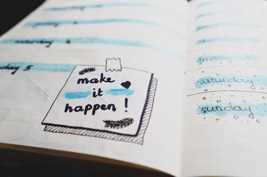 journal met postit met tekst make it happen